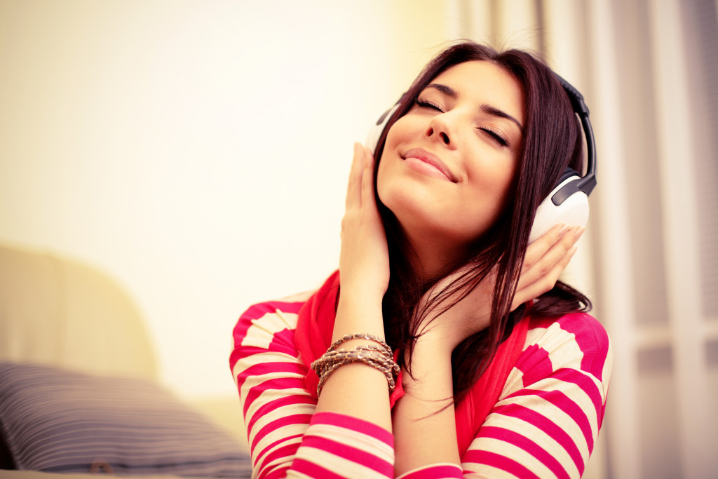 A young lady enjoying her headphone's music