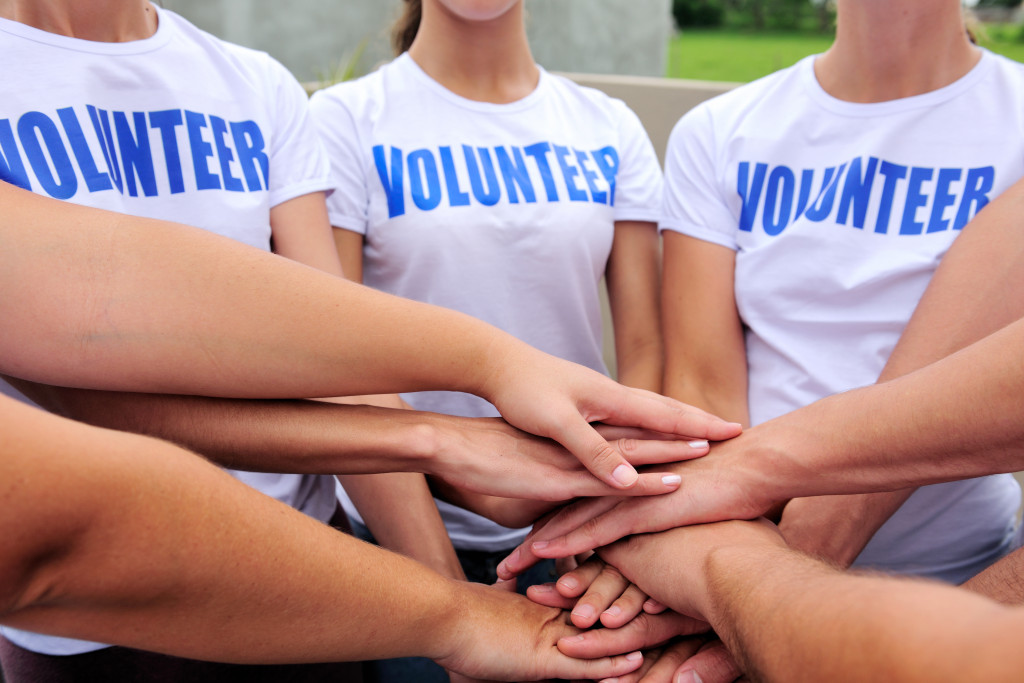 volunteers hands together
